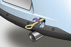 -  Dans le pare-chocs arrière, déclippez le cache en appuyant sur sa partie basse.