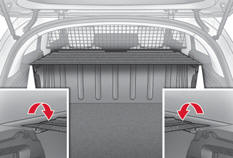 - Enroulez le cache-bagages sur luimême près des sièges arrière.